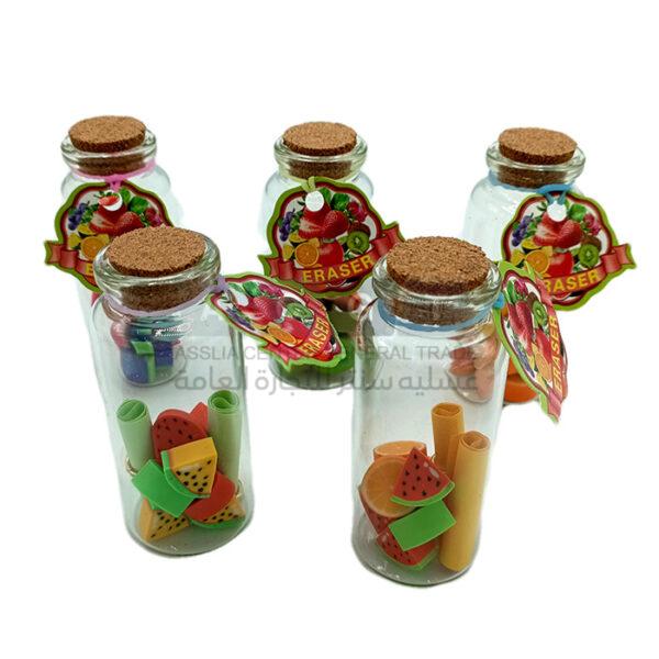 محايات مدرسية بأشكال فواكة داخل أنبوبة زجاجية